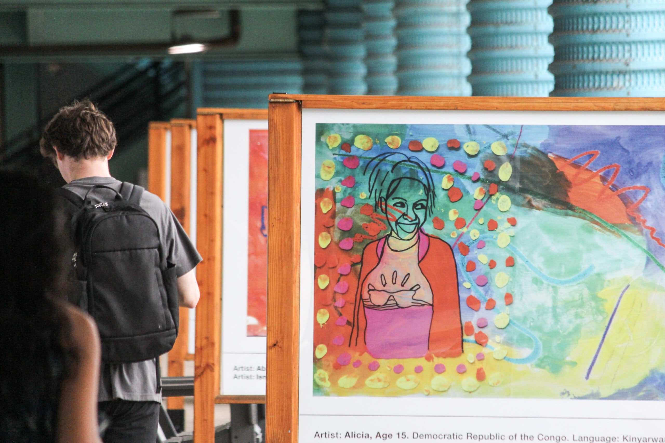 Student artists from Refugee Development Center bring colorful art to downtown East Lansing